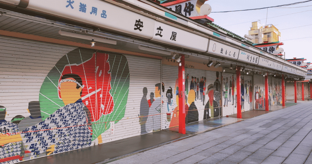 Nakamise shopping street with painted shutter art inside the Sensoji Temple gates