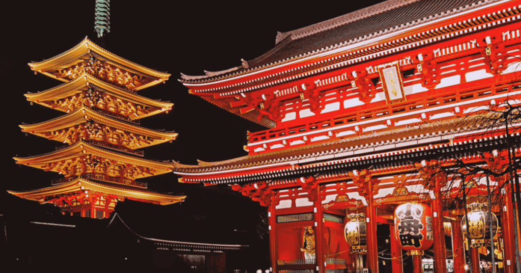 Sensoji’s Five-Story Pagoda and Hozomon Gate illuminated at night until 11 PM.
