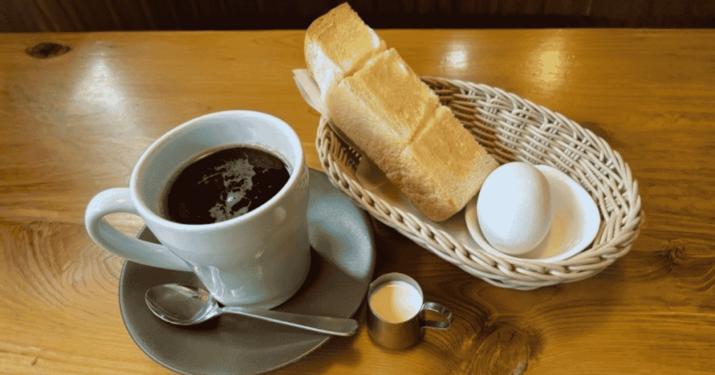 A standard morning set includes thick buttered toast and a boiled egg.